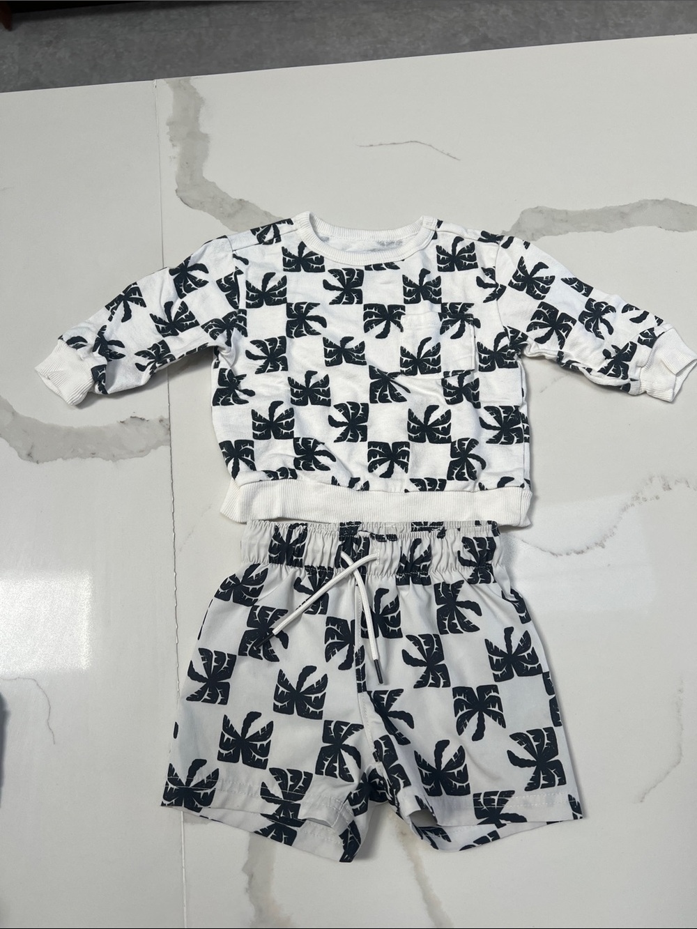 Old Navy White and Black Leaf-Print Kids knit top and swim bottoms